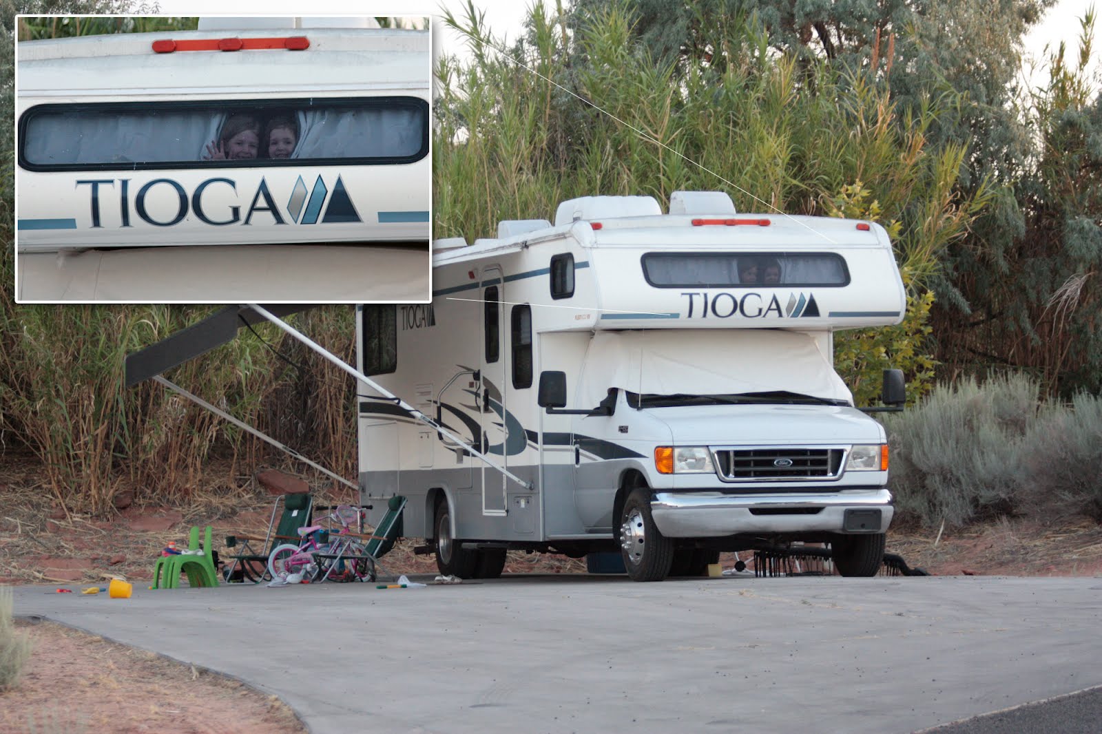 Kids peeking out the cabover window of the Tioga.